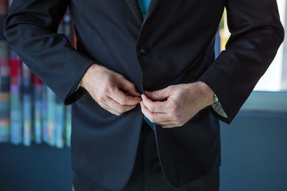 Raleigh NC headshot preparation – client choosing outfits for a professional photo session