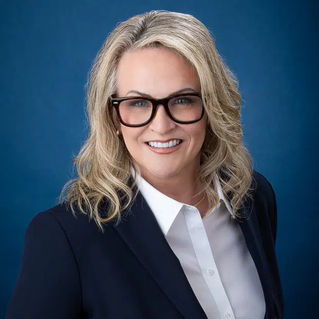 Raleigh NC photographer coaching client for confident professional headshots