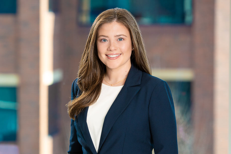 Professional attorney headshot in Raleigh NC with neutral background and polished look