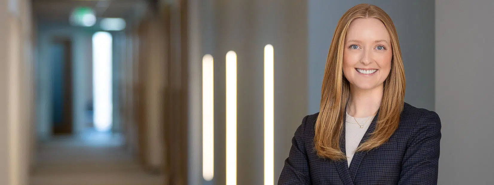 Attorney headshot in Raleigh office environment with natural professional lighting